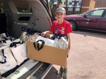 Colton loading Fun in the Sun Kits