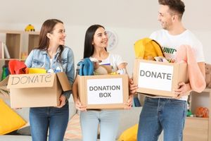 volunteers carrying boxes