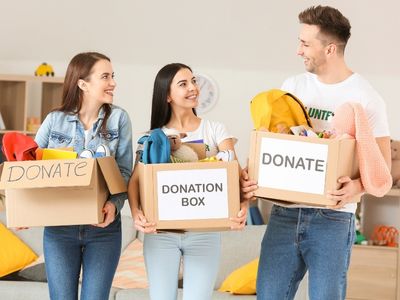 volunteers carrying boxes